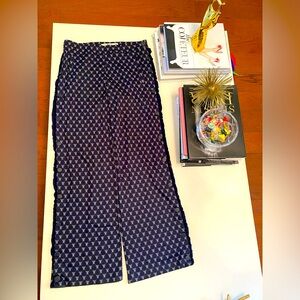 Tory Sport Tearaway wide leg track pants with frills on the side.